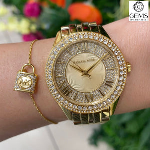 Ladies Michael Kors Watch Stainless Gold tone strap, Stone set dial SKU 4010101