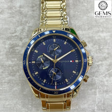 Load image into Gallery viewer, Gents Tommy Hilfiger Watch Stainless Steel Gold Tone Strap, Navy Dial, Mini Dials SKU 4016201
