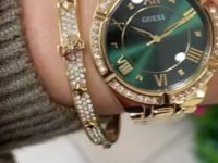 Load and play video in Gallery viewer, Ladies Stainless Steel Gold Tone, Stone Set Case, Green Dial Guess Watch SKU 4001354
