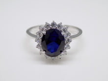 Load image into Gallery viewer, Sterling Silver Oval Blue CZ &amp; CZ Halo Ring SKU 0142002
