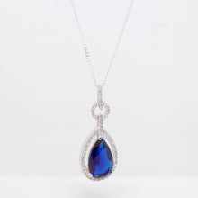 Load image into Gallery viewer, Sterling Silver Blue CZ Pear Shape CZ Halo Pendant SKU 0142007
