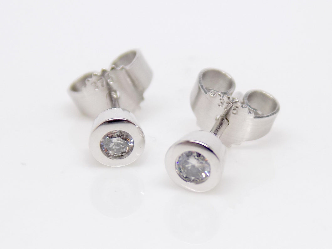 9ct White Gold Rubover Round Brilliant Diamond Earrings 0.10ct SKU 1642035